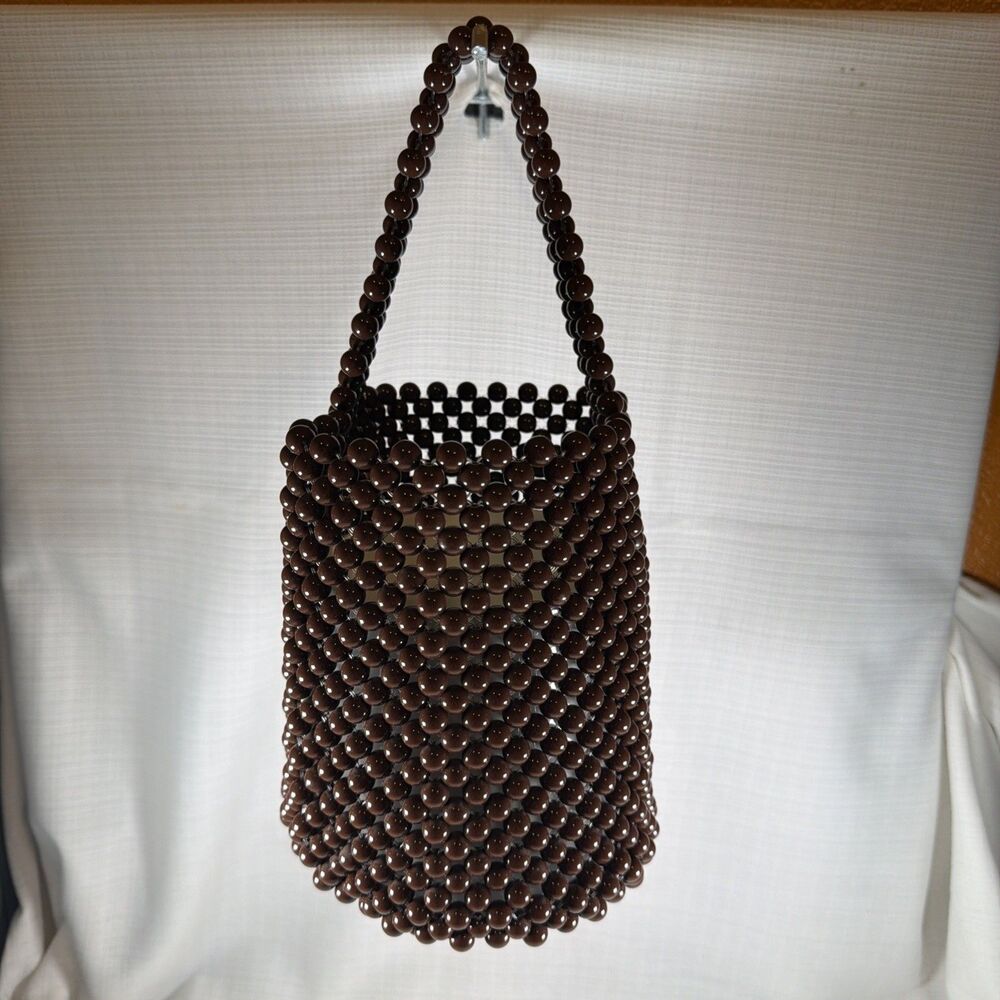 vintage-style dark brown woven wooden bead bucket bag